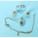 An emerald and white stone cluster pendant on 9ct gold fine chain, a 9ct gold emerald and white