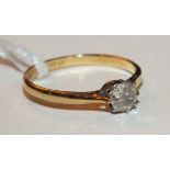 A solitaire diamond ring claw set an old brilliant cut diamond of approximately 0.3ct in 18ct yellow