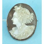 An oval shell cameo brooch carved as a portrait of Flora, in plain unmarked yellow metal mount, 31 x