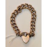 A 9ct rose gold bracelet of large curb links with padlock clasp, 23.7g.