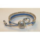 Links of London, a Wimbledon bracelet of cream and blue cord and silver batons.