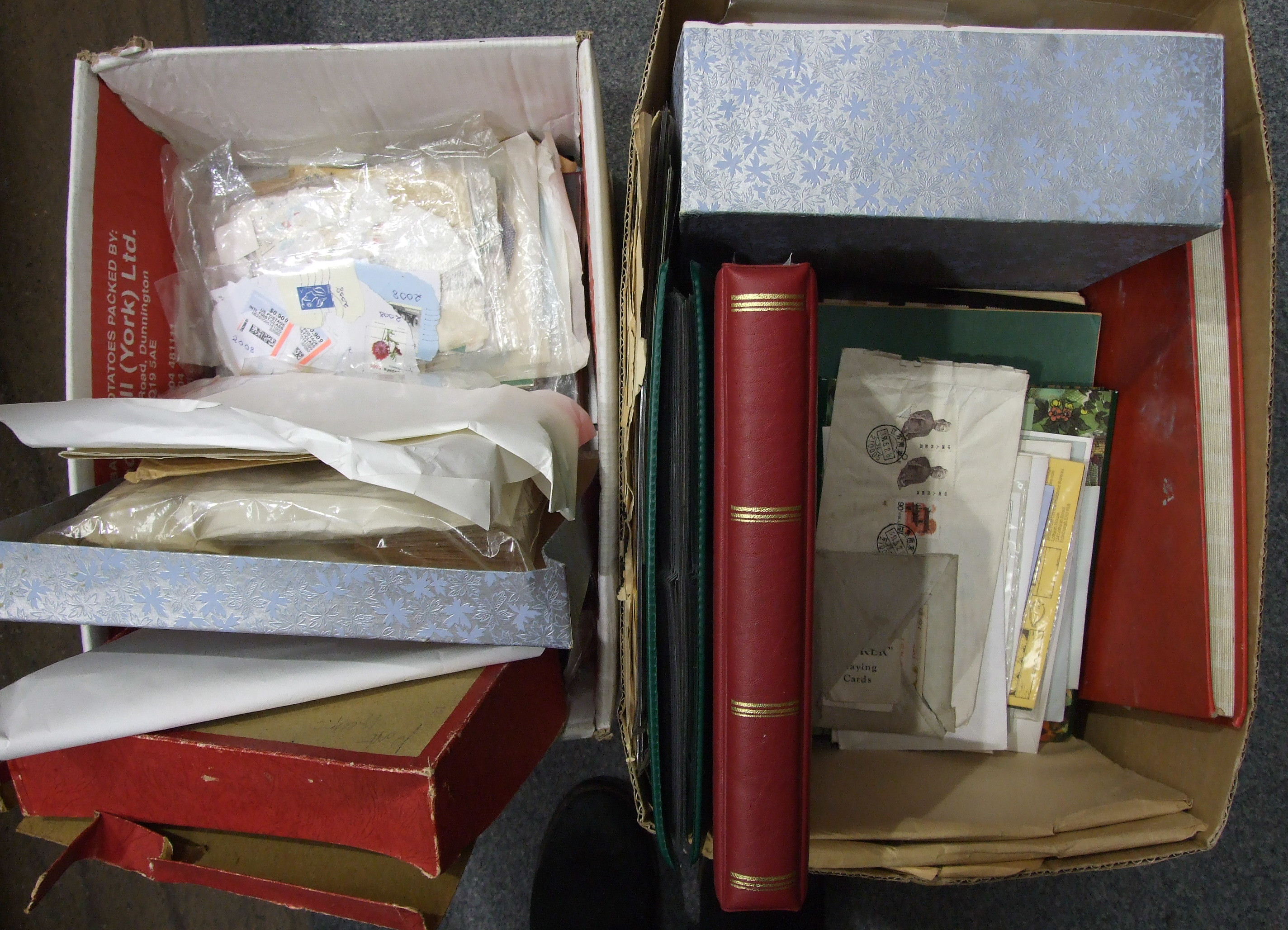 A large accumulation of stamps and covers in albums, stock books and loose, contained in two boxes.