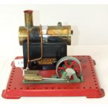 Mamod, a horizontal stationary steam engine with burner.