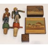 Two novelty carved softwood bottle corks, one in the form of a moustached man with two pistols, a