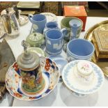 A collection of Wedgwood blue and green jasperware, including jug, tankards, candlestick, a quantity