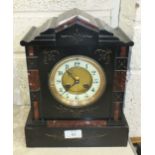 A black slate and marble mantel clock with French striking movement, 29.5cm high.