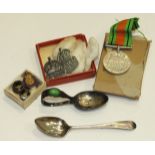 A silver ARP badge, one other, a 1939-45 Defence Medal, a child's silver feeding spoon and other