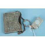 An Edwardian miniature silver book sleeve with carrying chain containing a leather bound Book of