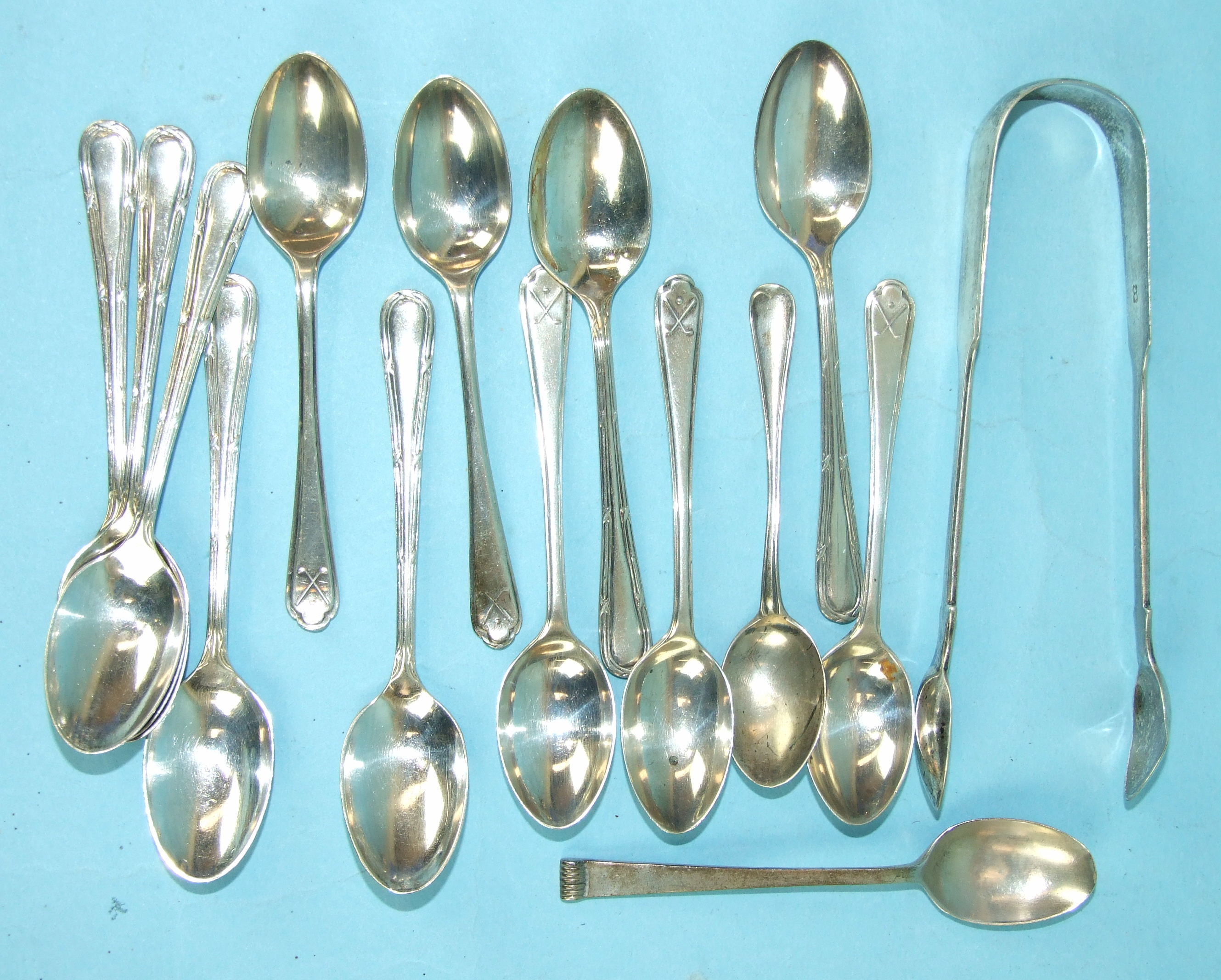 A pair of Victorian sugar tongs, Exeter 1862, seven silver teaspoons, Sheffield 1921 and other