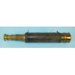 A 19th century three-draw lacquered brass 1¼" telescope, the leather grip with rope twist borders,