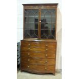 A George III mahogany bow fronted secretaire bookcase, the moulded cornice above a pair of gothic