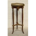 A Continental two-tier whatnot plant stand, the hexagonal marble top with cut brass gallery, on