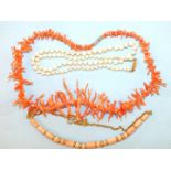 A pink twig coral necklace, 41cm long, a pale pink/white coral bead necklace, 49cm and a necklace of