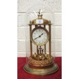 A German gilt metal 400-day timepiece of typical pillared dome form, under glass dome, 42cm