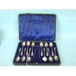 A cased set of twelve silver teaspoons and sugar tongs, Sheffield 1912.