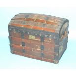 A late-Victorian metal and wood-bound hessian-covered travelling trunk with domed lid and old