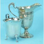 A Mappin & Webb silver cream jug, Birmingham 1911 and a silver pedestal cream jug, London 1925, (