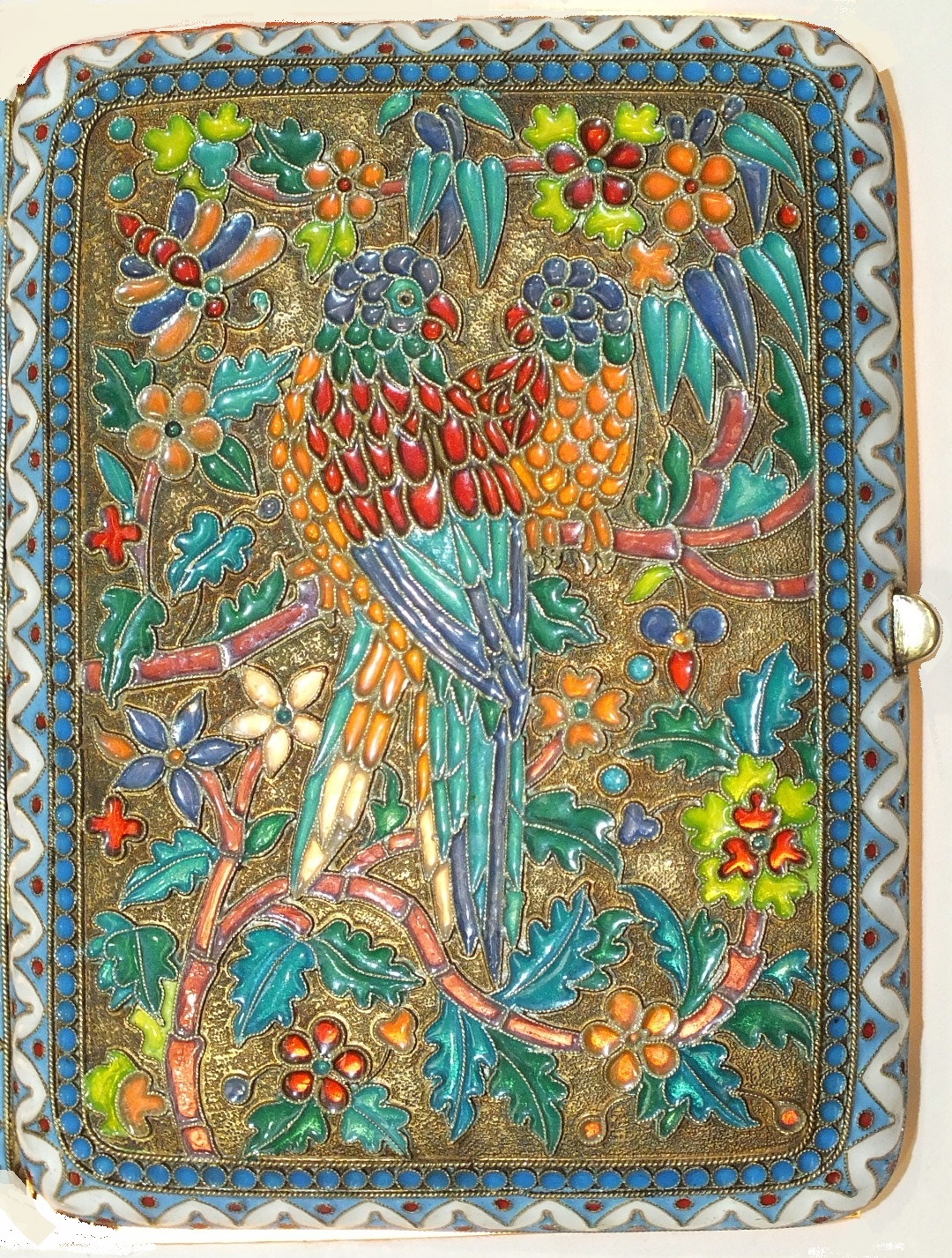 A Russian silver gilt and plique-à-jour enamel cigarette case, each hinged side decorated with a