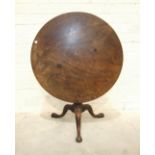 An 18th century mahogany circular tilt-top table, the original top and bird cage action on turned