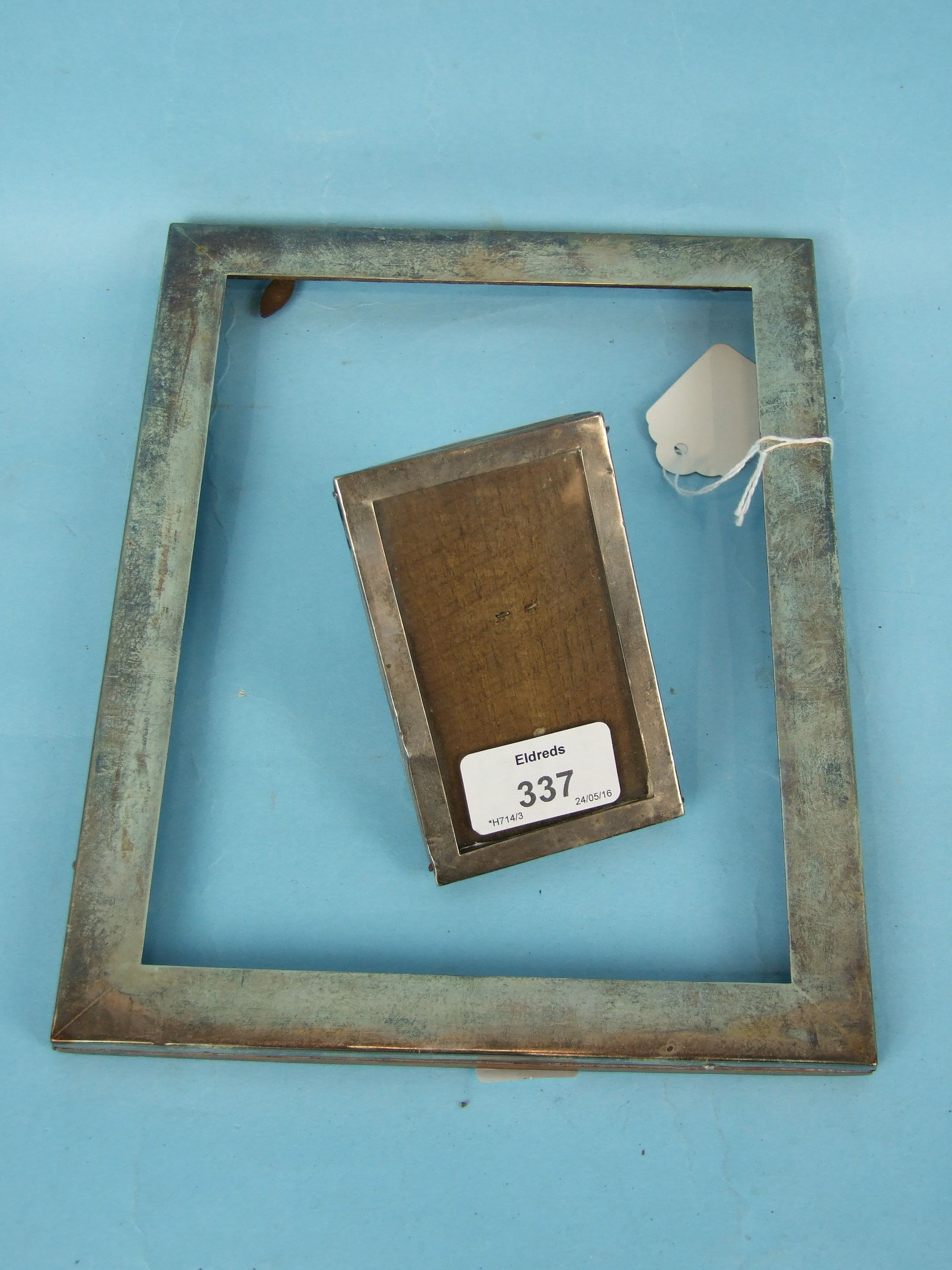 A small silver rectangular photograph frame, 6.5 x 10.5cm, Birmingham 1918 and a similar, larger,