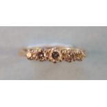 A five-stone diamond ring, claw set five graduated diamonds in 18ct white and yellow gold mount,