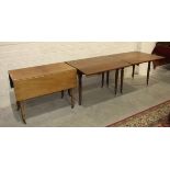 Three 19th century mahogany drop-leaf tables on turned legs, forming a dining table, each section