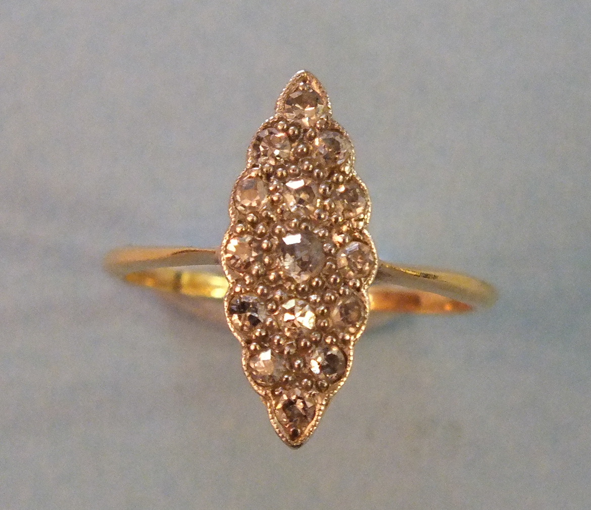 An Edwardian diamond marquise cluster ring set fifteen 8/8 cut diamonds in yellow and white 18ct