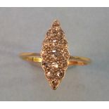 An Edwardian diamond marquise cluster ring set fifteen 8/8 cut diamonds in yellow and white 18ct