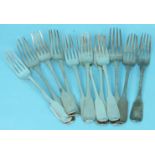 Eleven mainly early 19th century fiddle pattern silver table forks, various dates, makers and