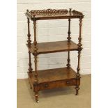 A Victorian burr walnut three-tier whatnot, the galleried top and tiers separated by turned columns,