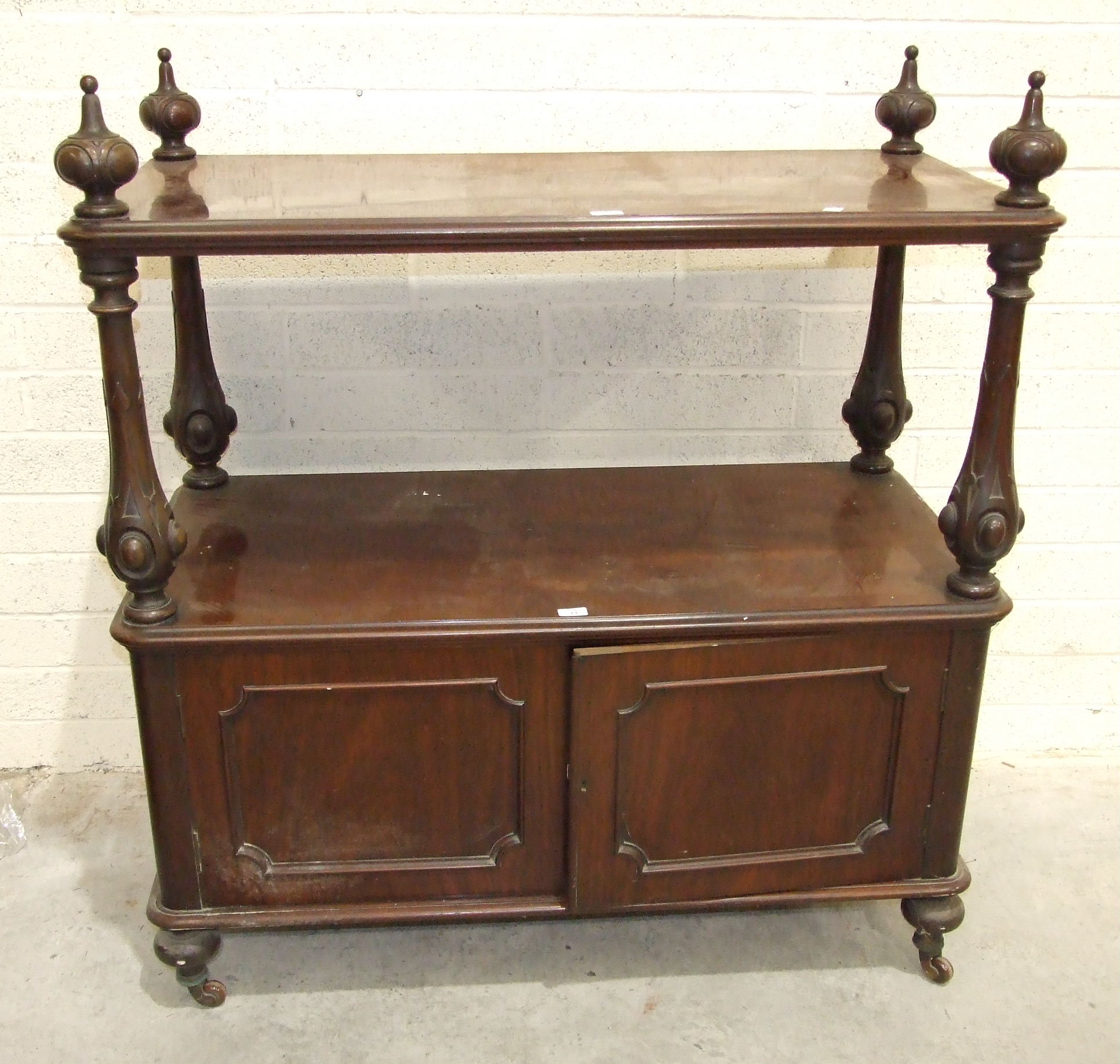 A Victorian walnut two-tier dinner wagon, the upper tier with moulded edge on carved turned