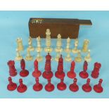 An ivory and red stained ivory chess set, king 10cm high, (one pawn incomplete, white queen's finial