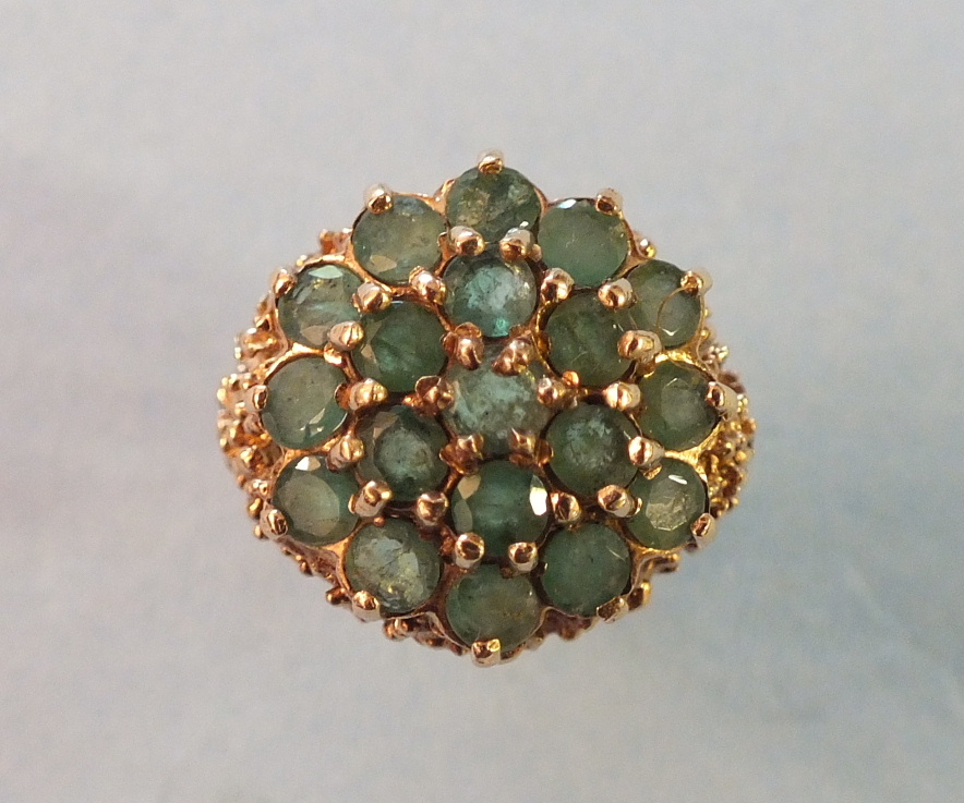 An emerald cluster ring, claw set nineteen round cut emeralds in 9ct gold mount, size J, 5.5g.