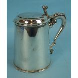 A Georgian-style lidded tankard with leaf capped scroll handle and glass base, maker William