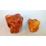 Two golden Baltic amber specimens, 22.8g and 6.3g, the larger with a mosquito inclusion, (2).