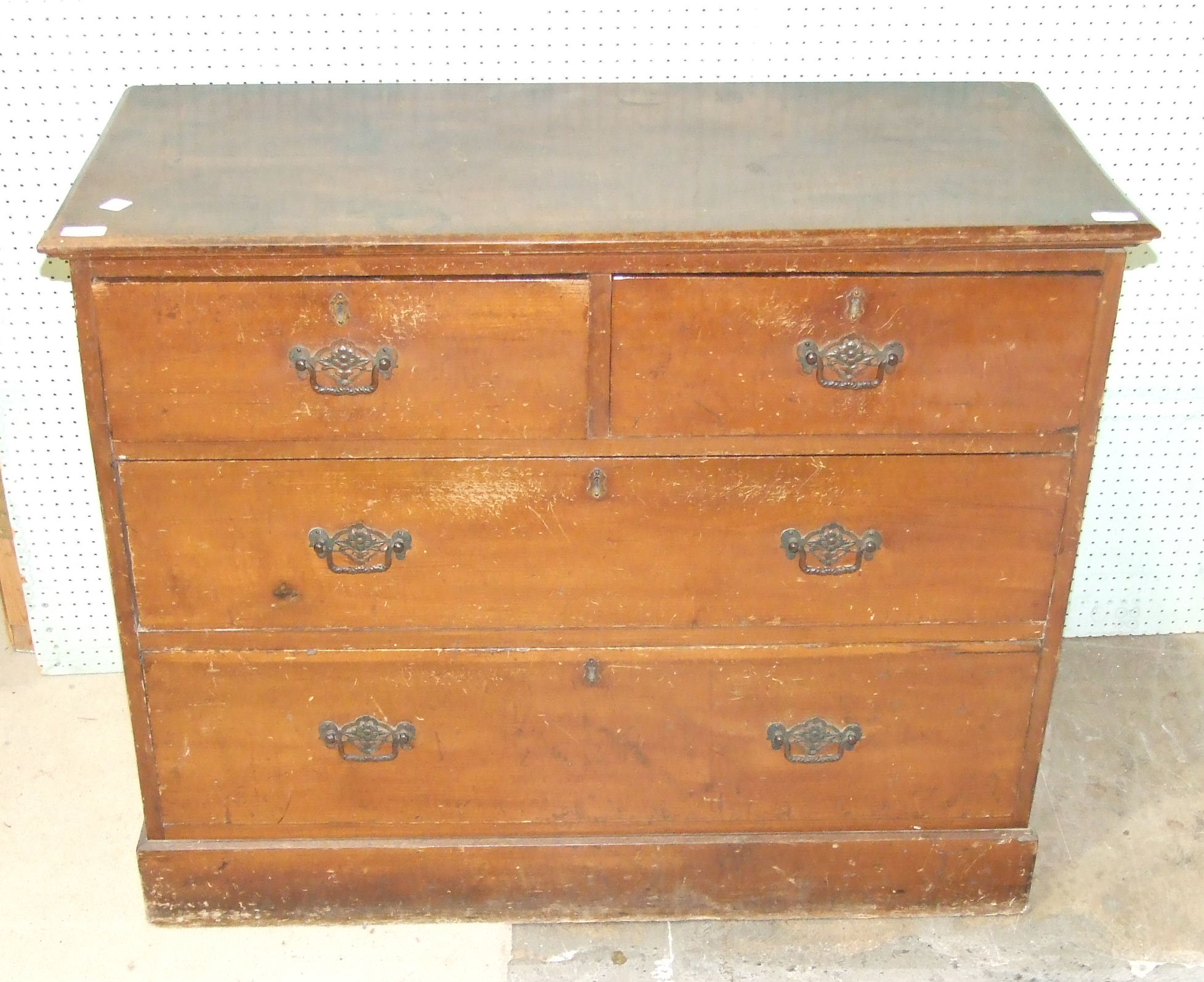 A 19th century stained wood rectangular chest of two short and two long drawers, on plinth base (