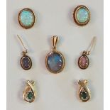 A pair of opal earrings with yellow metal mounts, a pair of black opal doublet earrings and matching
