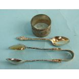 A pair of Wang Hing Chinese sugar tongs, a matching teaspoon and a napkin ring.