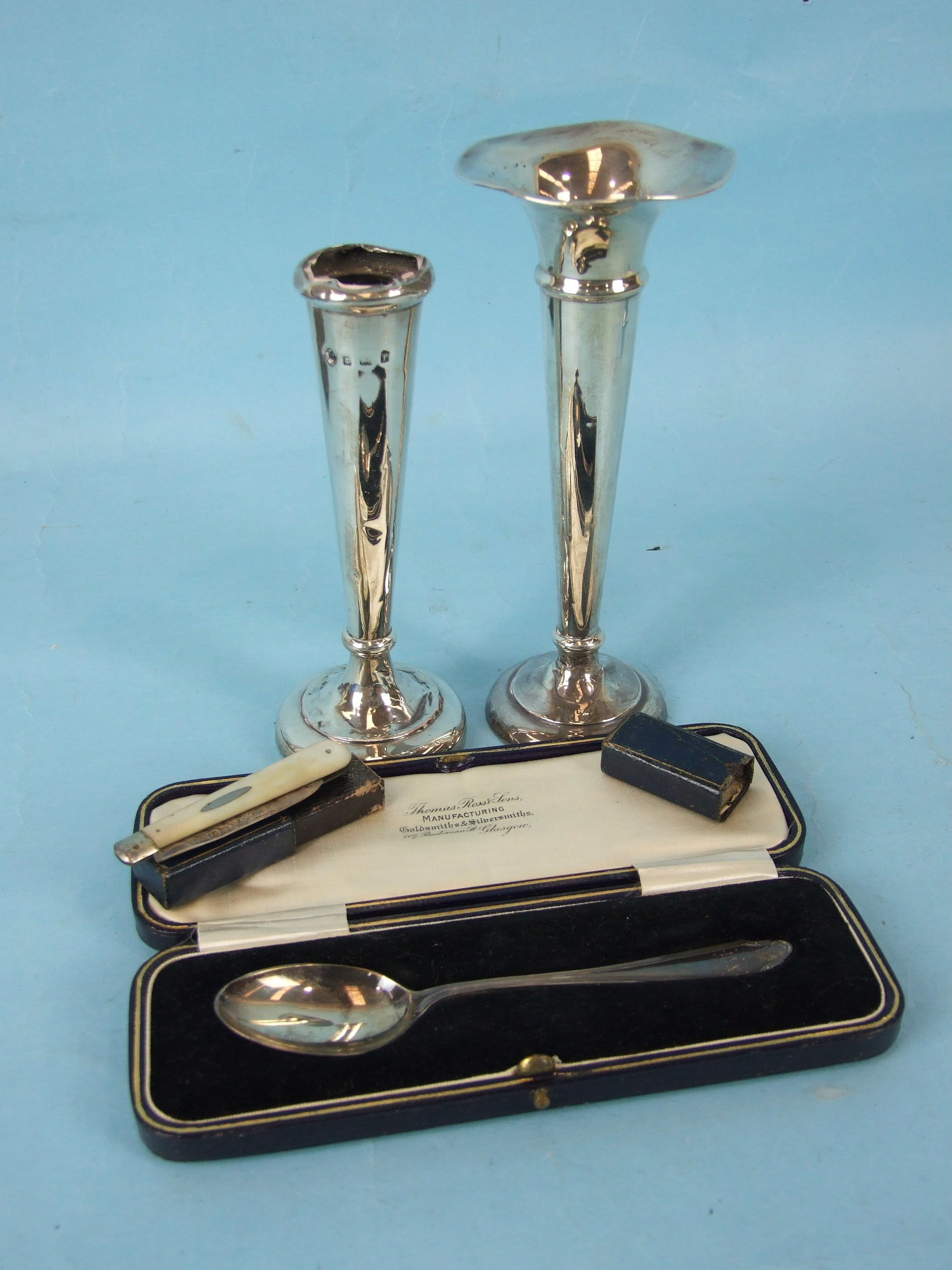 A cased christening spoon, Sheffield 1925, a silver spill vase, marks rubbed and other items.