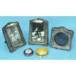 A modern miniature silver photograph frame of arched square form with round aperture, 6.6cm square