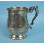 A silver tankard of baluster form with leaf capped scroll handle, maker William Neale Ltd,