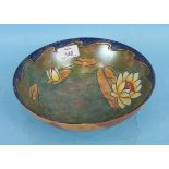 A Burleighware opalescent glazed bowl decorated with lilies in green, blue and brown mottled