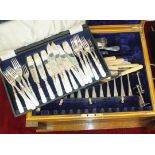 A canteen of plated Old English Pattern cutlery, twelve place settings, in fitted oak case fitted