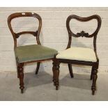 A set of four Victorian mahogany balloon-back dining chairs with upholstered seats, on octagonal