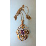 An Edwardian 9ct gold open-work pendant set amethyst, on trace chain, 3.5g.