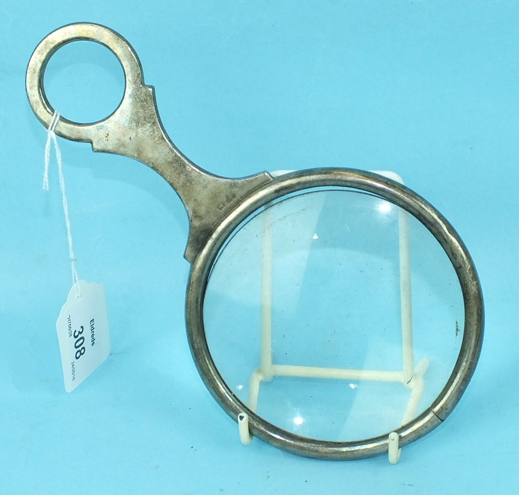 A silver-mounted magnifying glass by G & S Co. Ltd, London 1909, 21cm long, (a/f).