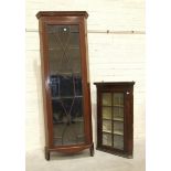 An Edwardian Georgian-style mahogany tall corner cupboard, the inlaid cornice above an astragal