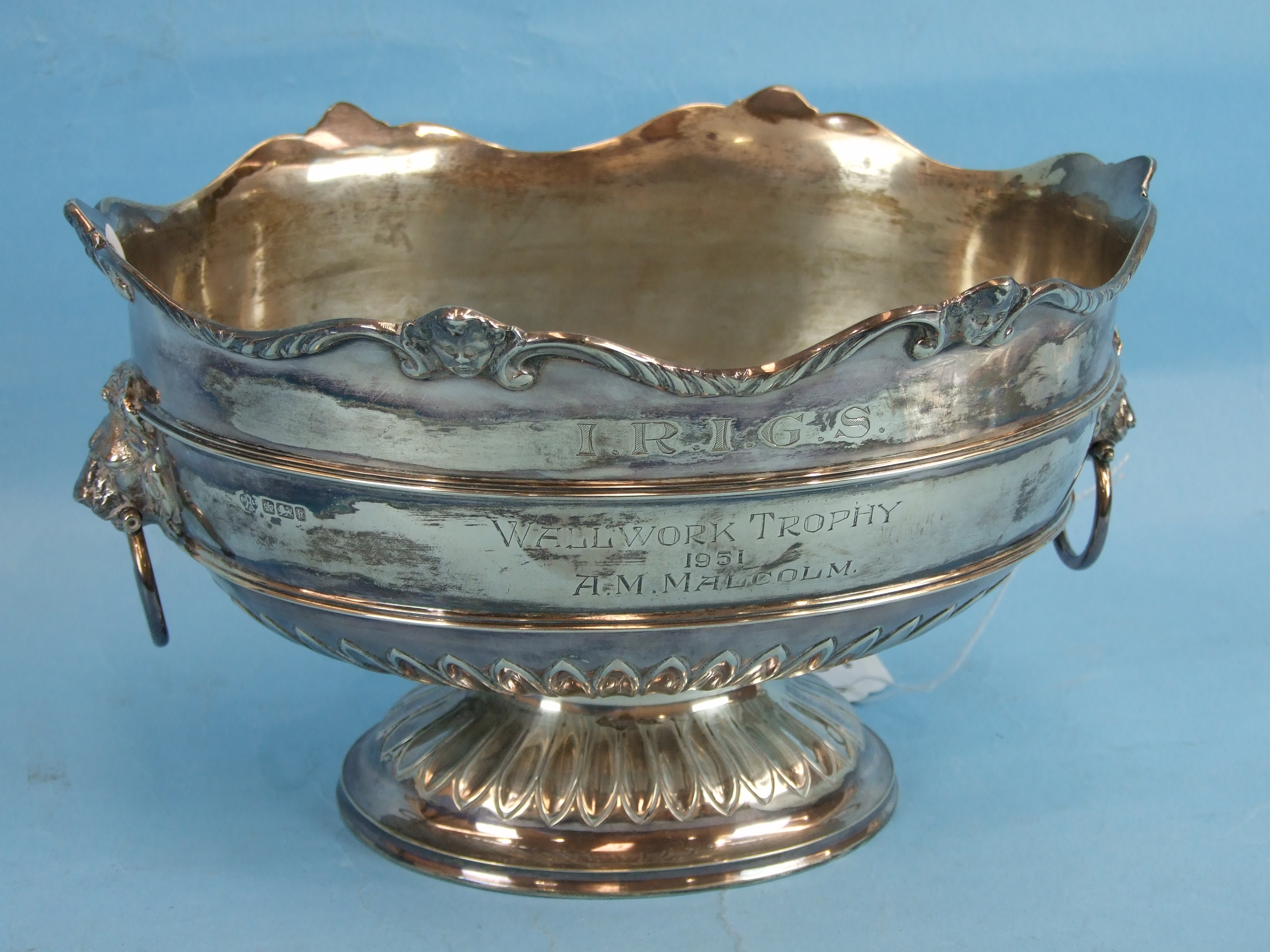 An Edward VII silver rose bowl of oval form with scroll and mask border and lion masks handles,