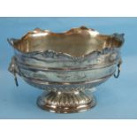 An Edward VII silver rose bowl of oval form with scroll and mask border and lion masks handles,