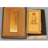 A Dunhill gold-plated lighter in original fitted box with paperwork, dated 1983.